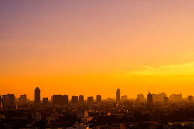 Cityscape against sky during sunset