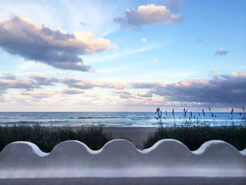 Scenic view of sea against cloudy sky