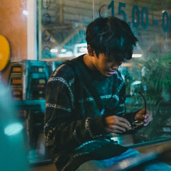 Young man using mobile phone