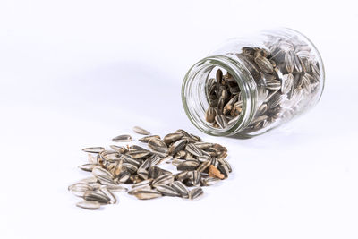 Close-up of glass jar against white background