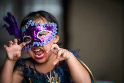 Portrait of cute girl in halloween costume.