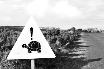 Close-up of stop sign on road