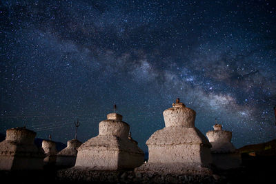 Castle against sky at night