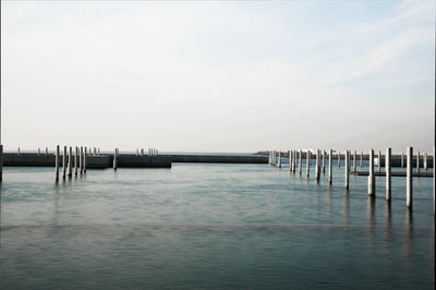 Pier on sea against sky