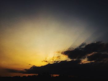 Scenic view of dramatic sky at sunset