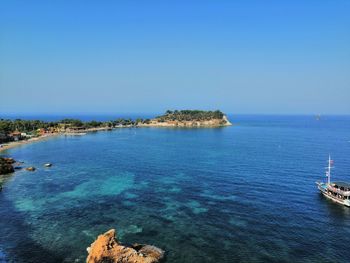 Scenic view of sea against clear blue sky