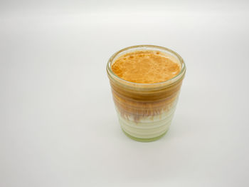 High angle view of drink against white background