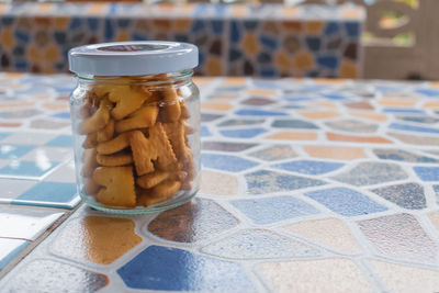 Close-up of glass of jar on table