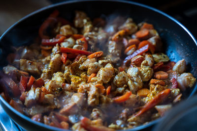 Vegetable stew, cooking chicken with vegetables. process of cooking. frying pan with vegetables