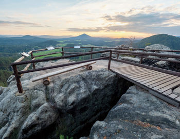 Tourist view platform on vilemina rock. popular viewpoint above forest land of bohemia switzerland