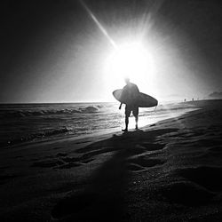 Silhouette of people on beach