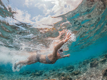 Man swimming in sea