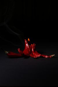 Close-up of red chili pepper against black background