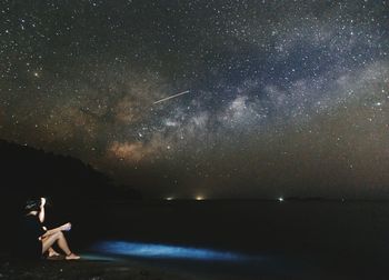 Full length of woman in water at night