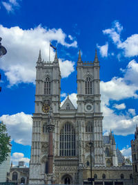 Low angle view of building against cloudy sky