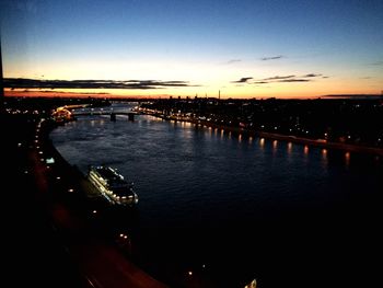 View of bridge over river at sunset