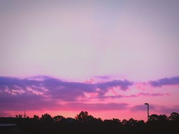 Silhouette of trees against sky at sunset