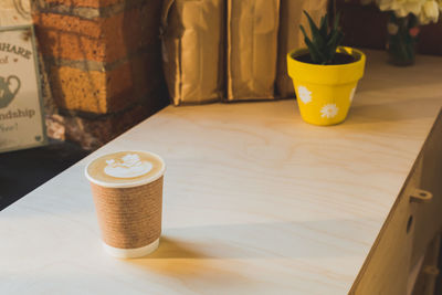 Close-up of coffee cup on table