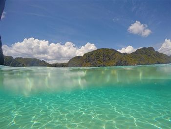 Scenic view of sea against blue sky