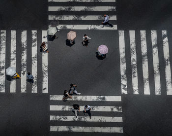 High angle view of people crossing street