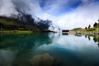 View of lake against cloudy sky