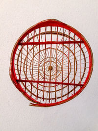 Directly above shot of red wall against white background