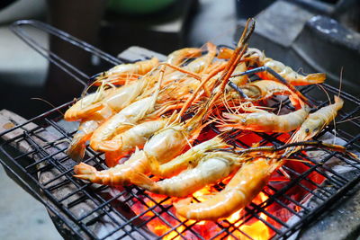 Close-up of meat on barbecue grill