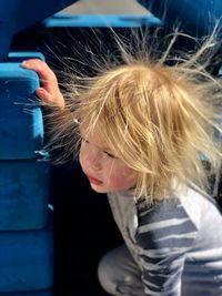 High angle view of girl with tousled hair