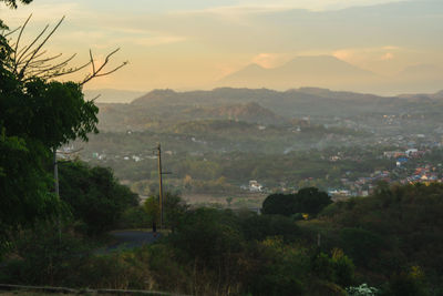 Scenic view of landscape against sky during sunset