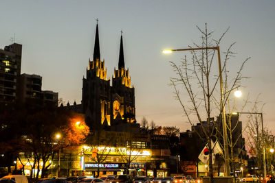 Low angle view of illuminated buildings at night