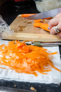 Close-up of orange food on cutting board