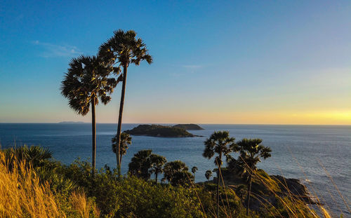 Scenic view of sea against sky at sunset