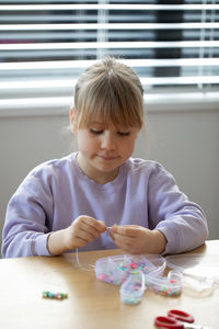 Cute girl painting at home