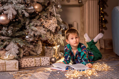 Boy in christmas tree