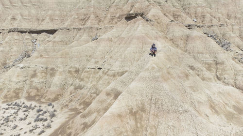 A man enjoying on betwen of stones mountains the bardenas reales, navarra. spain