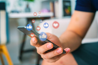 Close-up of woman using mobile phone