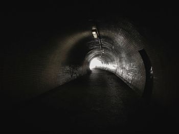 Footbridge over illuminated tunnel