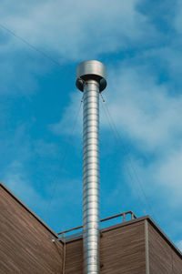 Low angle view of telephone pole against sky