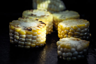 Close-up of food on table against black background