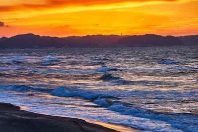 Scenic view of sea against sky during sunset