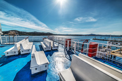 Panoramic view of swimming pool by sea against sky