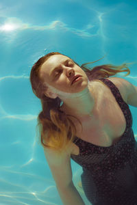 Woman swimming in pool