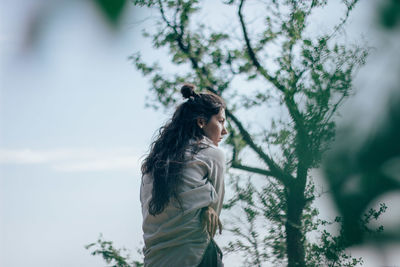 Woman dancing in forest