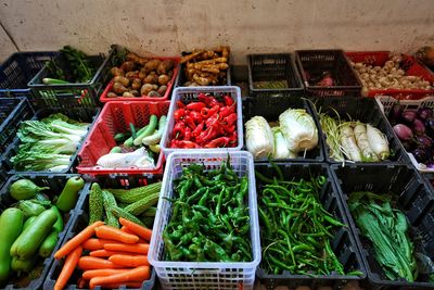 High angle view of vegetables arranged in market for sale