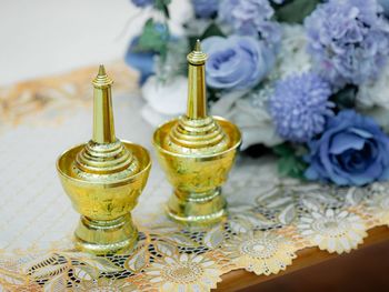 Close-up of golden equipment on table