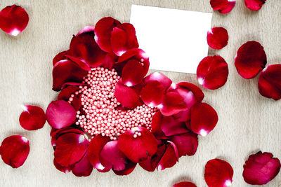 High angle view of red roses on table