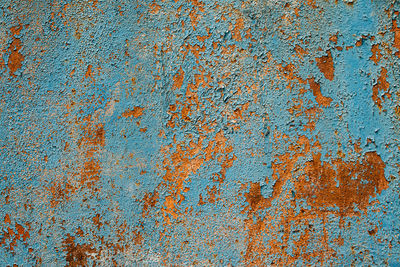Rusty metal turquoise and red color texture background. oxidated metal surface. old vintage painted
