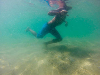 Man swimming in sea