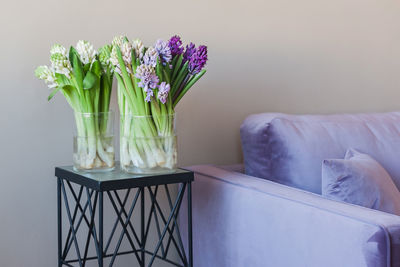 Flower vase on table at home