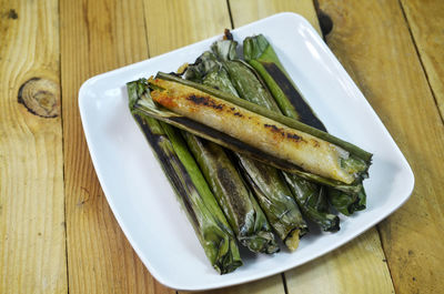 High angle view of fish in plate on table